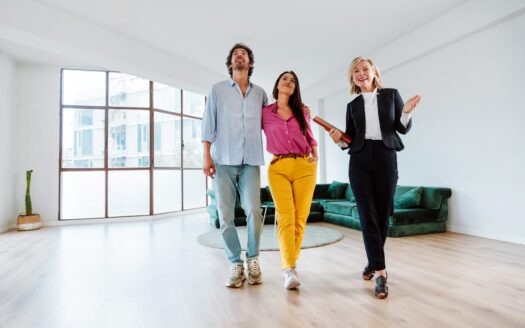 Real estate agent showing an apartment to a couple.